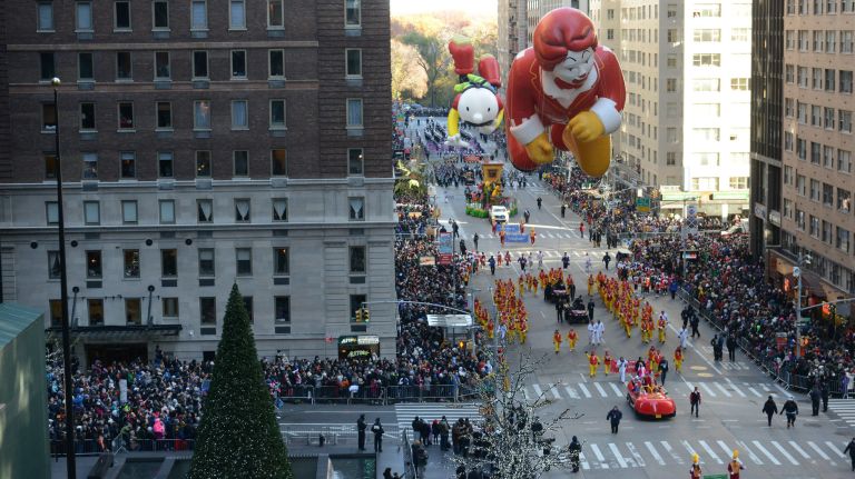 Balloons, floats -- including Ronald McDonald -- and bands delight the crowds on Sixth Avenue.