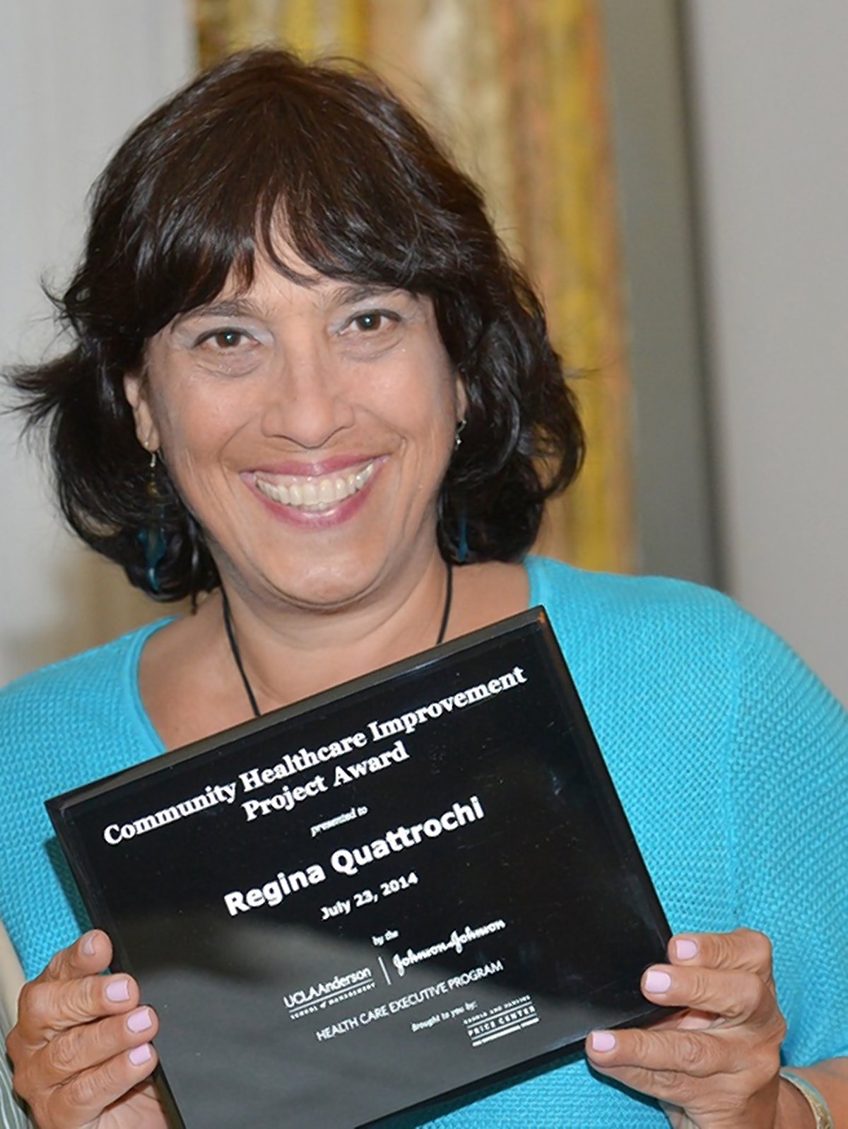 Gina Quattrochi receiving an award in 2014.