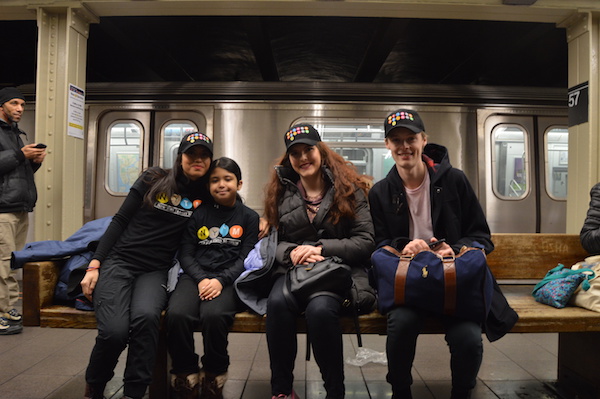 Transit Museum educators Christina Cuarado, Marie Fazio, and James Giovan, with Cuarado's daughter Sarah, waiting for the first Q train to travel up Second Avenue. | JACKSON CHEN