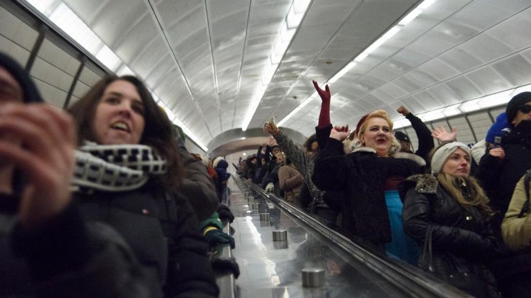 Participants in the 17th Annual No Pants Subway Ride cheer as they ride the escalator at the 34th Street-Hudson Yards train station in Manhattan on Sunday, Jan. 7, 2018.