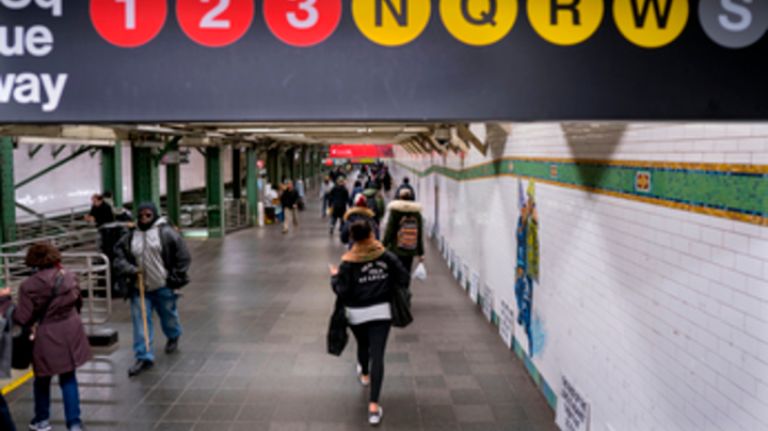 A corridor between subway lines at Times Square.