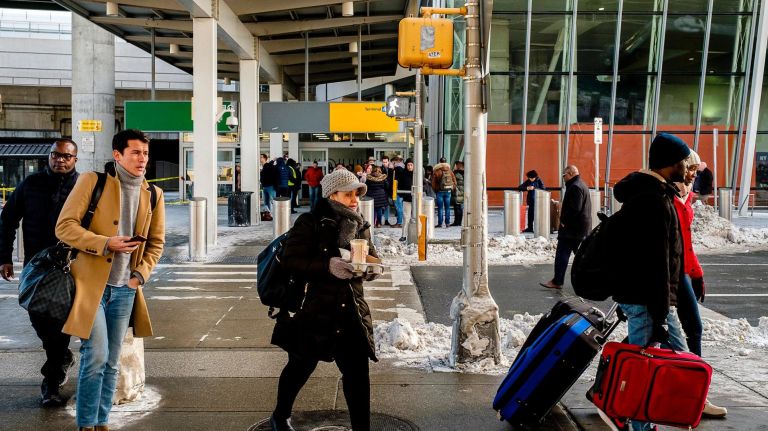 JFK water main break at Terminal 4 causes further flight delays 2 Passengers exit after a water main ruptured in Terminal 4 at JFK airport, Sunday, Jan. 7.