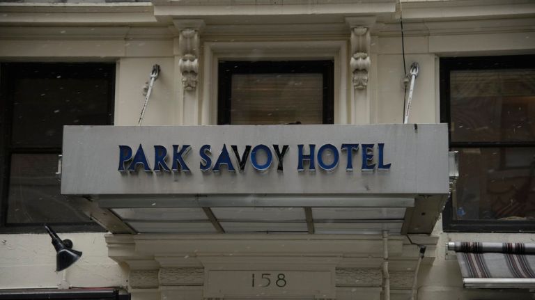 The city's plan to turn the Park Savoy Hotel in Manhattan into a homeless shelter has garnered mixed reactions from business owners and residents.