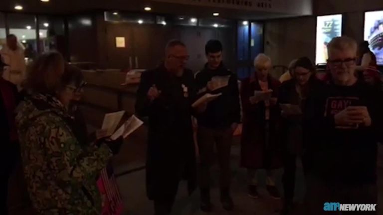 Gays Against Guns members sing 'God Help America' 1 Gays Against Guns members sing ‘God Help America’