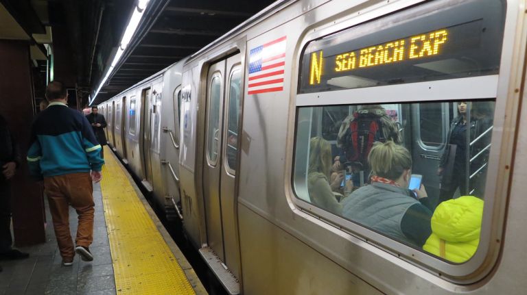 N, Q, R and W trains were delayed because of a train with mechanical problems at Fifth Avenue-59th Street, the MTA said.