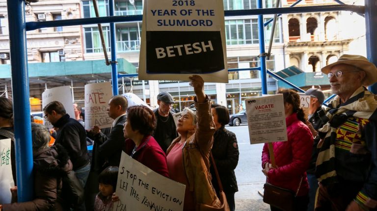 Displaced tenants of 85 Bowery are joined by housing advocates on Thursday, April 26, as they demand a deadline to be able to return to their building. 