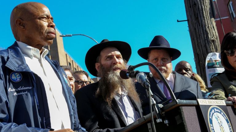 Rabbi Eli Cohen speaks at a news conference on Monday along with Brooklyn Borough President Eric Adams and other Crown Heights community leaders to denounce recent anti-Semitic crimes in the area.