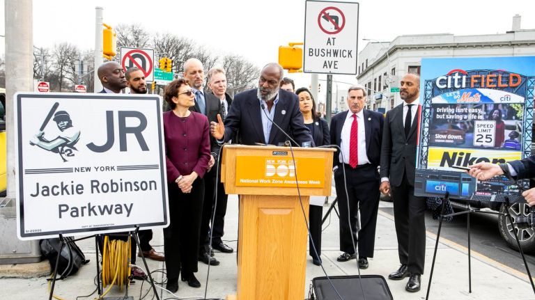 David Robinson speaks Thursday at a ceremony to honor his father, Jackie Robinson, whose image will grace signs along his eponymous parkway in Brooklyn and Queens. 
