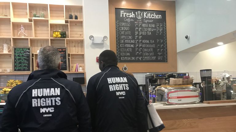 New York City Commission on Human Rights Bias Response Team members talk to Fresh Kitchen staff Friday following an anti-immigrant rant at the location that went viral.