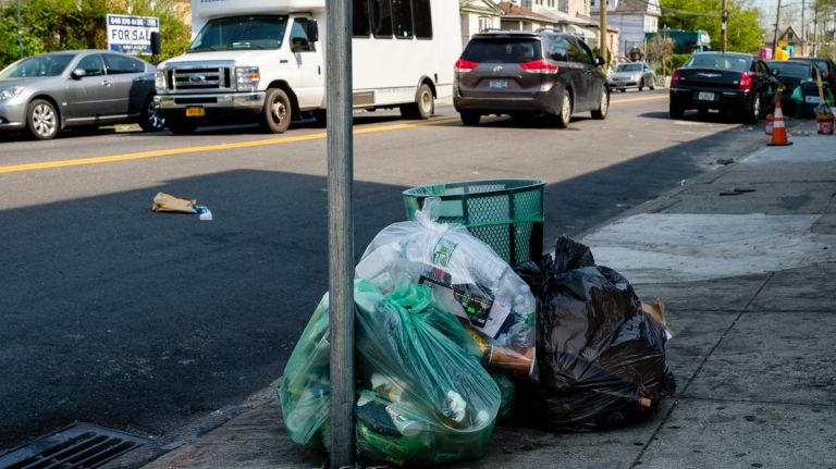A cleanup effort along Guy R Brewer Boulevard in Jamaica resulted in several extra bags of trash waiting for pickup on Thursday, May 3, 2018.