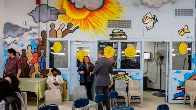 A mural at the New York Public Library's new branch at the Manhattan Detention Complex was designed and painted by detainees.