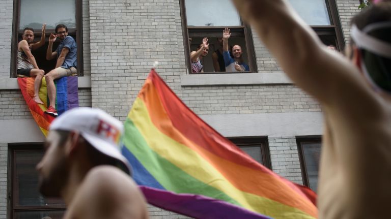 Pride parade NYC: Photos of the 2018 march through Manhattan 49 Friendly waves from an apartment on Christopher Street.