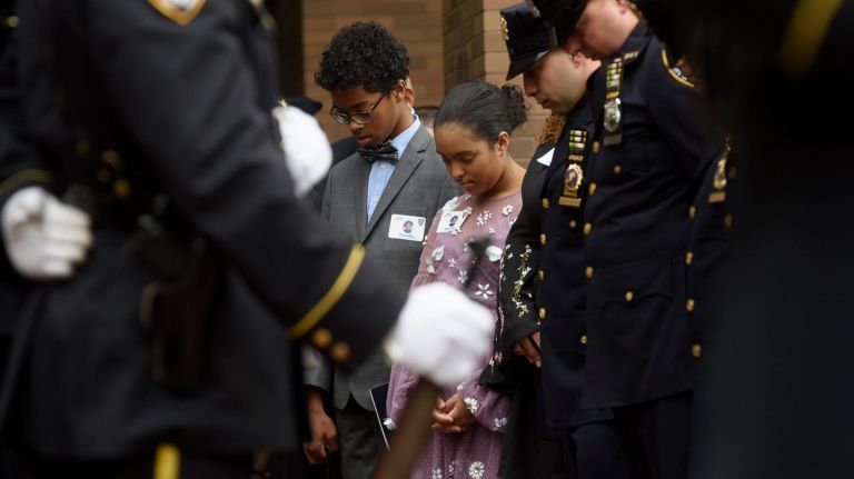 Twins Peter and Delilah Vega, two of slain NYPD Det. Miosotis Familia's children, attend a medal ceremony at police headquarters on Wednesday. 