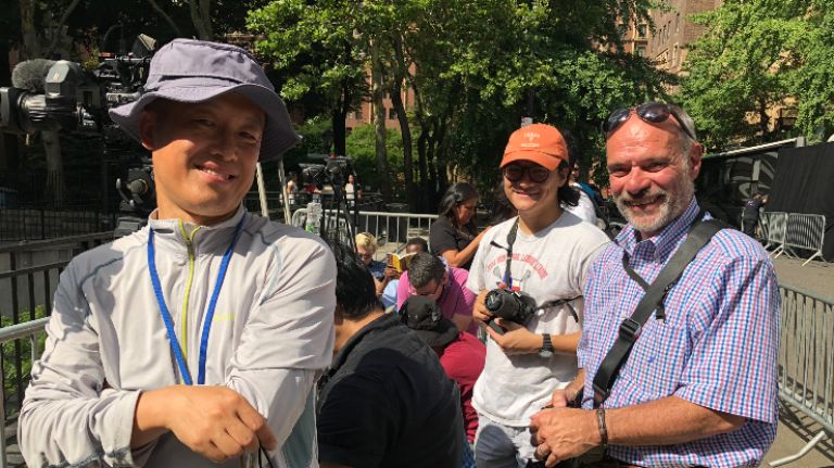 How to get the perfect Manhattanhenge photo? Patience, folding chairs and no water 2 Winston Zhou, 52, from left, Josh Nguyen, 28, and Glen Viglone, 64, wait Thursday for the Manhattanhenge sunset phenomenon at the Tudor City overpass.