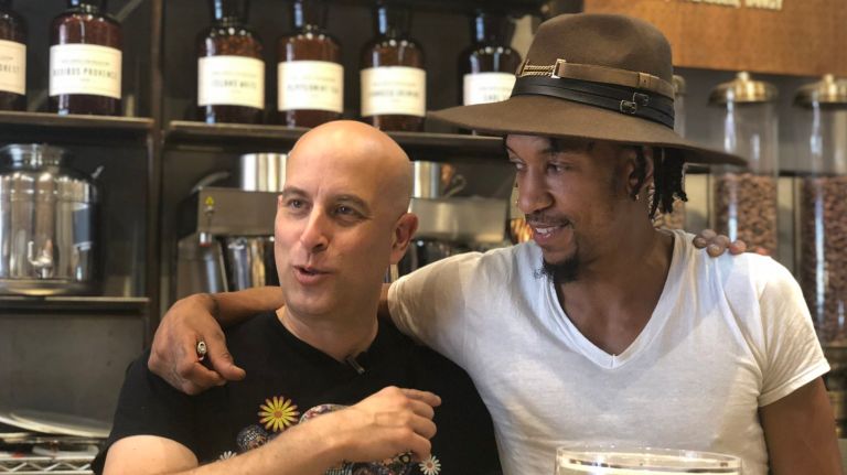 At Blue Stripes, there’s no such thing as ‘too much chocolate’ 4 Blue Stripes co-creator Oded Brenner (pictured, left) poses behind the counter with Markiss Koffee, master coffee trainer.