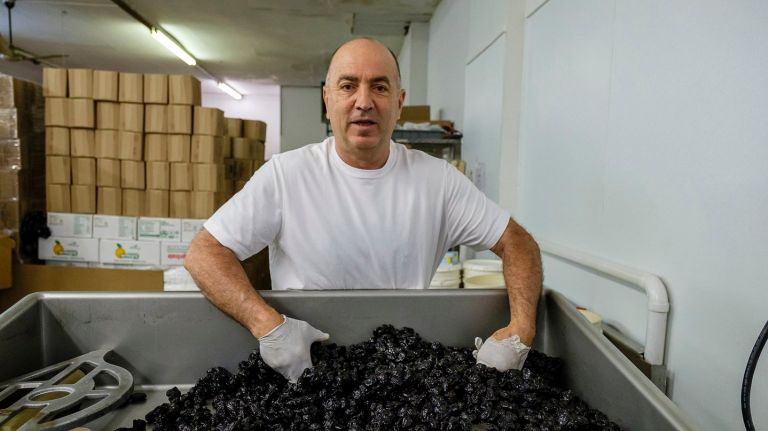 Ray Shalhoub, owner of Brooklyn-based Joray, shows dried plums used to manufacture a natural product called Fruit IQ.