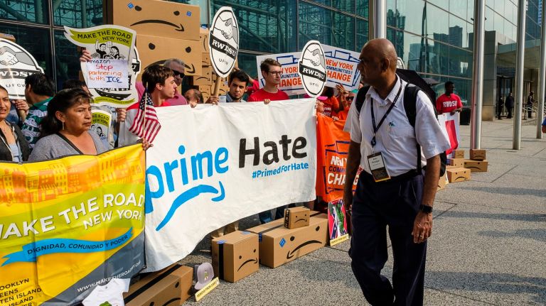 Amazon protesters in Manhattan say e-retailer must stop profiting from hateful products 2 A Prime Day protest outside the Javits Center, where Amazon Web Services was hosting a summit, in Manhattan on Tuesday saw the company's logo turned into a frown.
