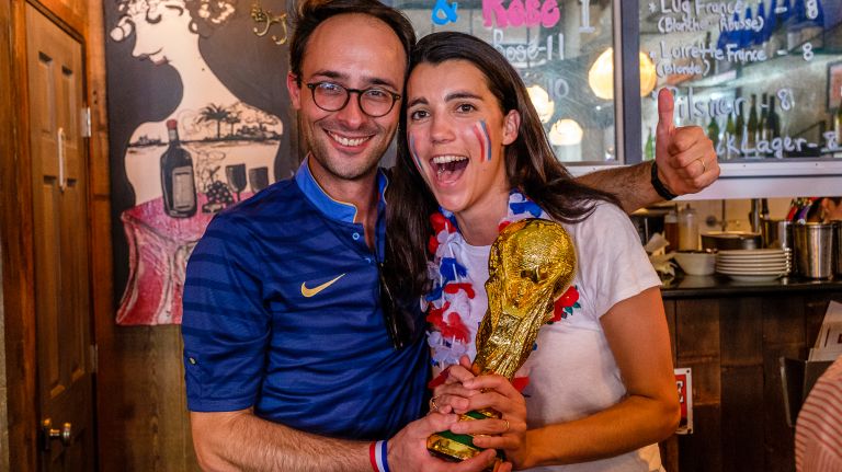 New Yorkers celebrate France's domination in World Cup Final 14 Fans of team France celebrate with a replica of the World Cup.