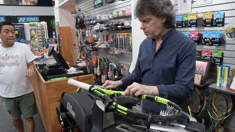Tennis pro on what to expect when buying your first racket 2 NYC Racquet Sports owner Woody Schneider strings a new racket.