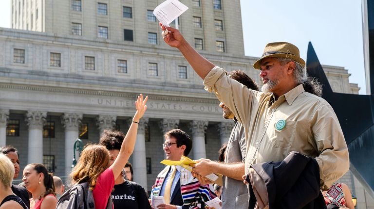 Ravi Ragbir, right, rallies with supporters at Foley Square after his federal appeals court appearance on Tuesday.