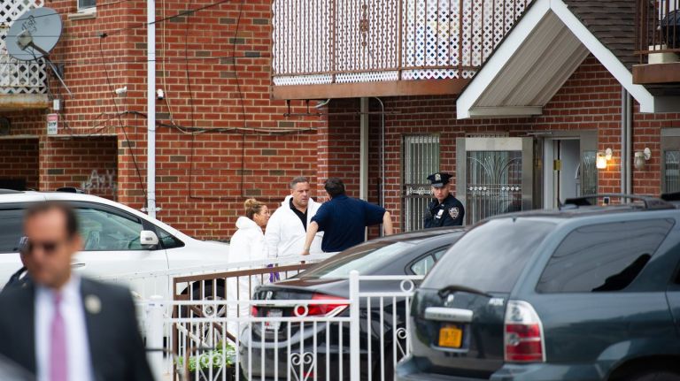 NYPD investigators stand outside a Queens birthing center where a woman allegedly slashed three babies and two adults on Friday, Sept. 21, 2018.