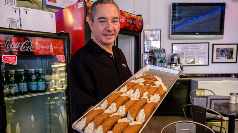 San Gennaro cannoli contest treats come straight from the Cannoli King 4 John Delutro opened Caffe Palermo 45 years ago.