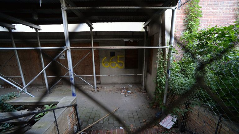 Dozens of ousted households filed a lawsuit last week against property owner Kings & Queens Holdings LLC, seeking millions after the building burned in 2012.