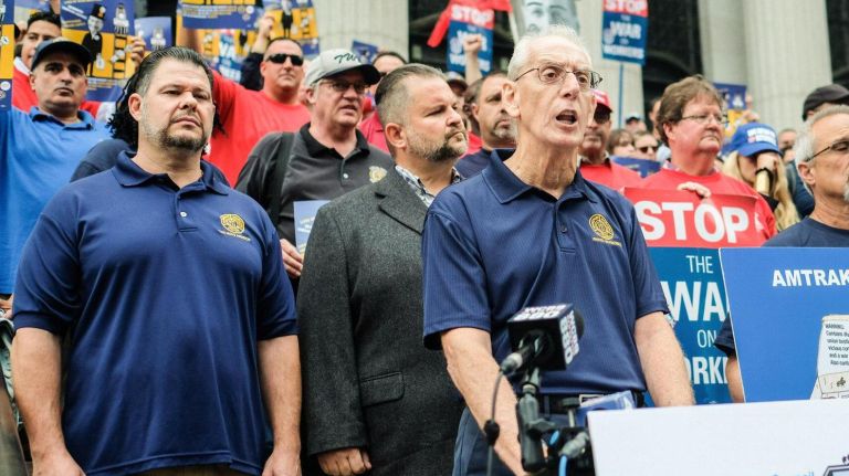John Feltz, the railroad division director of the Transport Workers Union of America, at a union worker rally against Amtrak's proposed cuts to 1,700 on-board service staff on Tuesday, Oct. 9, 2018.