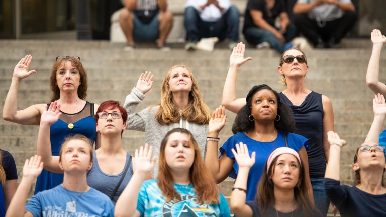 Protesters stood on the steps of the post office on 33rd Street in midtown on Sunday to demonstrate against the appointment of Judge Brett Kavanaugh to the Supreme Court.