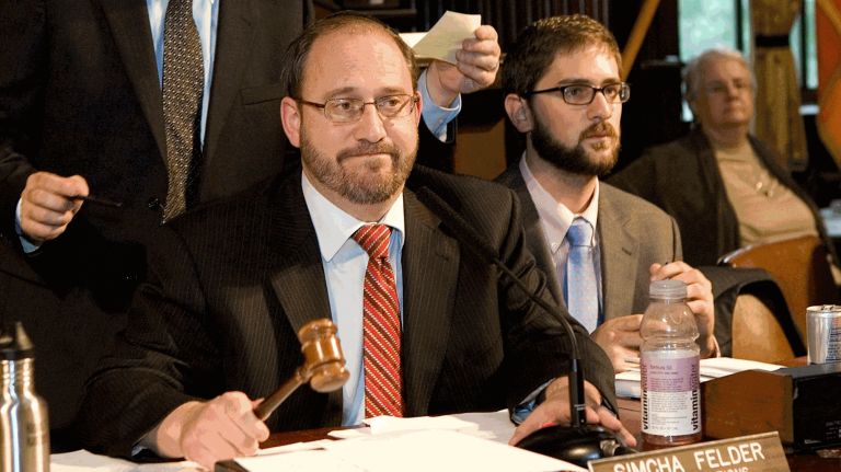 Simcha Felder, left, won re-election in Senate District 17.