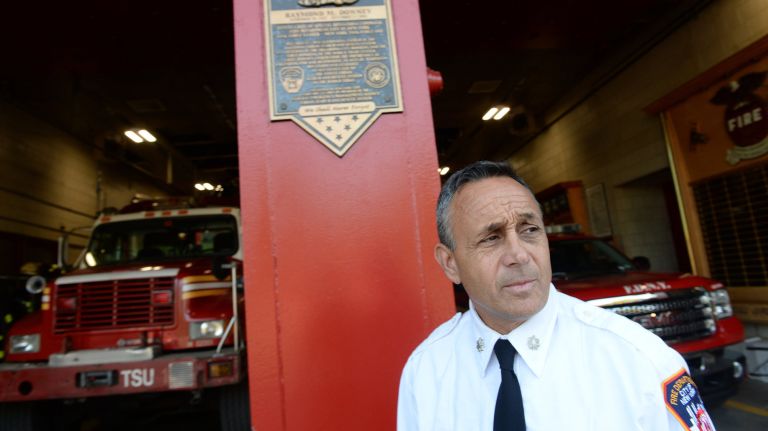 FDNY Battalion Chief Joseph Downey, of Deer Park, seen Wednesday with&nbsp;a plaque at the Roosevelt Island firehouse&nbsp;honoring his father, Deputy Chief of Special Operations Raymond&nbsp;Downey, who died in the 9/11 attacks.&nbsp;