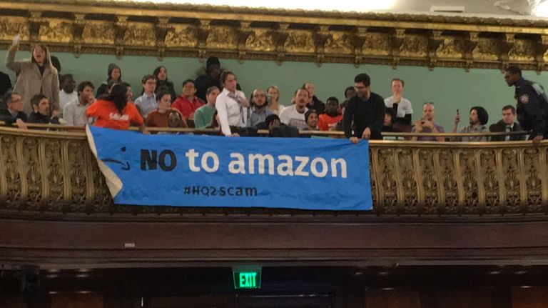 Demonstrators protested Amazon's Long Island City plans in front of the City Council in December, and the resistance continued on Monday.