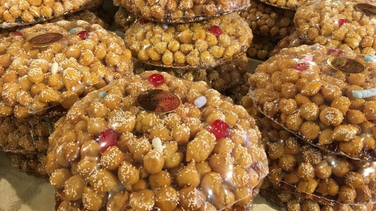 Ferrara Bakery in Little Italy has stacks of struffoli.