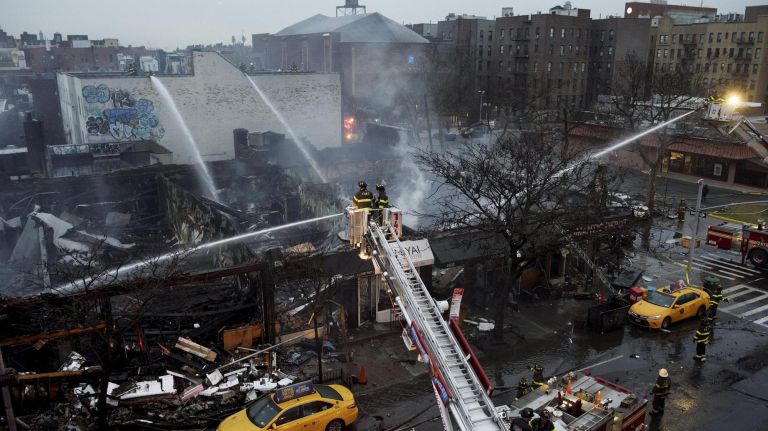 A multiple-alarm fire in a strip of commercial buildings on Queens Boulevard in Sunnyside on Thursday gutted six businesses.