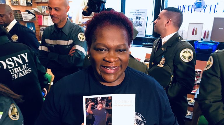 Department of Sanitation calendar spotlights city's unsung workers 2 Pauline Sealy poses with her October photo in the NYC Sanitation Department's 2019 calendar on Tuesday.