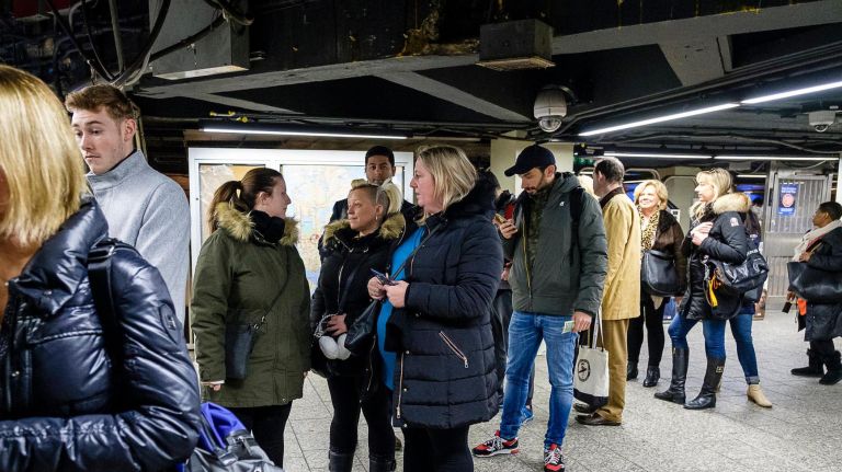 "Game of Thrones" fans line up to snag limited-edition MetroCards at Grand Central Terminal on Tuesday.