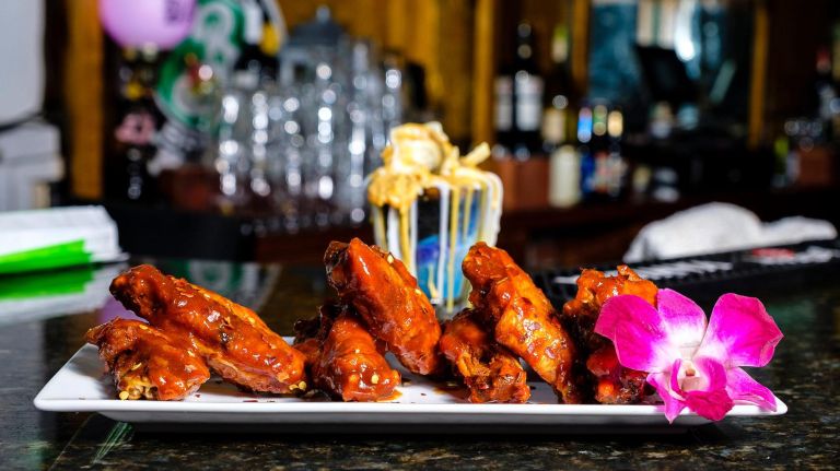 Dishes include the Hateful 8 Wings.