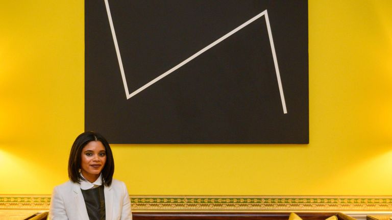 'She Persists' at Gracie Mansion celebrates a century of female artists 2 Exhibit curator Jessica Bell Brown with the painting "Yesterday" by Carmen Herrera at the press opening for an exhibit that features the work of 44 female artists at Gracie Mansion.