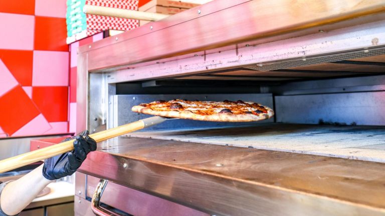 New midtown pizzeria Upside looks to elevate the standard slice 3 The slice shop bakes its pies in a Montague Hearth Bake brick oven.