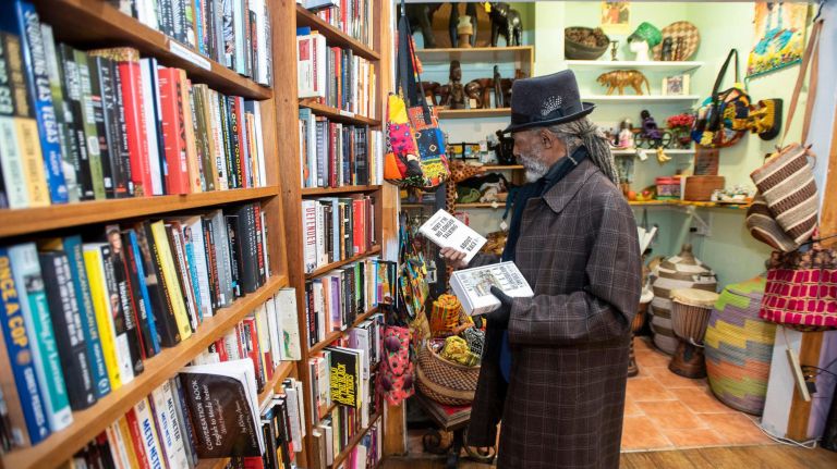 Olivio Du Bois, great-grandnephew of W.E.B. Du Bois,&nbsp;browses the shelves.&nbsp;