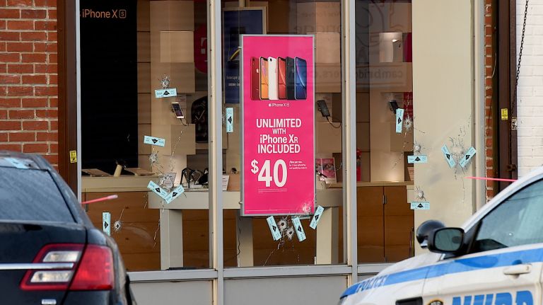 2nd suspect sought in Queens robbery that led to NYPD friendly-fire death 2 A second suspect was being sought after an NYPD detective was killed while responding to an attempted robbery of a T-Mobile store in Richmond Hill on Tuesday. Bullet holes were visible in the store windows the next day.