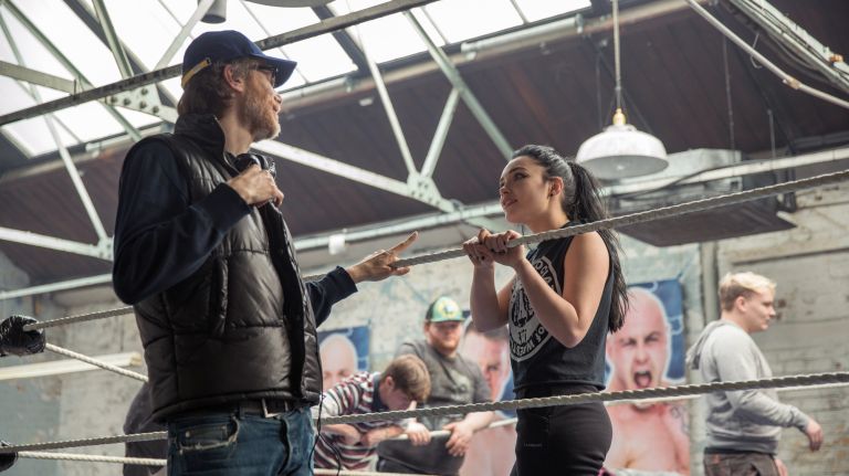 Director Stephen Merchant, left, and actress Florence Pugh on the set of "Fighting with my Family." 