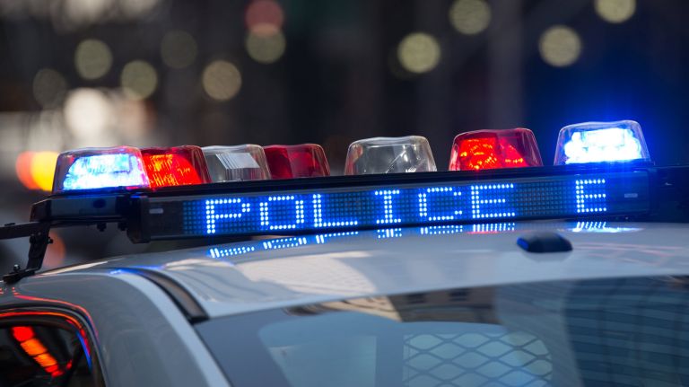 A New York City teacher's aide was charged with forcibly touching a teenager on the bus on Staten Island, police said Tuesday.