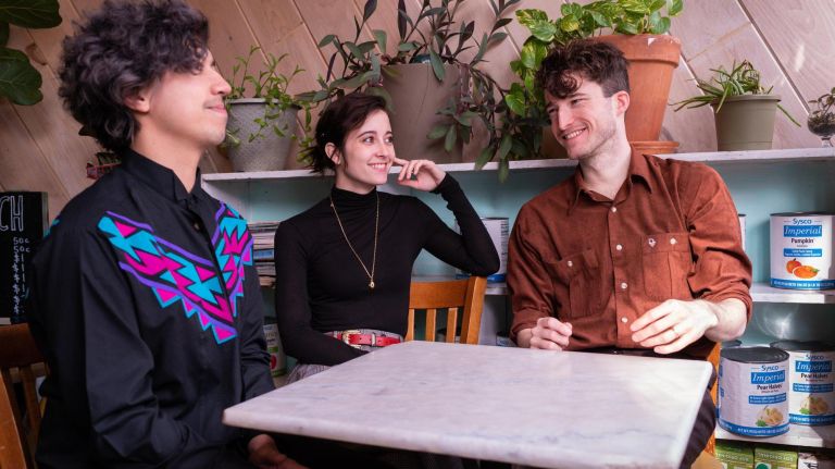 Nation of Language members, from left, Michael Sui-Poi, 32, Aidan Devaney, 26, and Ian Devaney, 28, talk about building an audience at Pel's Pie Co. in Brooklyn. 