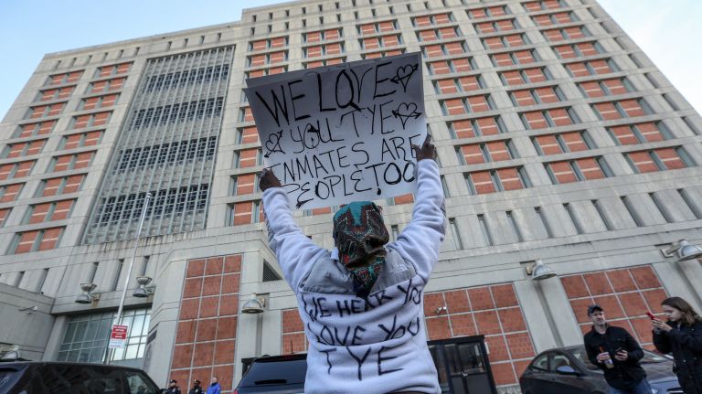 Demonstrators protest Sunday outside the Brooklyn Metropolitan Detention Center in Sunset Park, where inmates have lived with limited electricity and heat for almost a week.