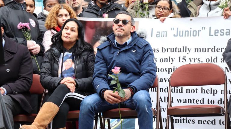 Lesandro&nbsp;"Junior" Guzman-Feliz's parents, Leandra Feliz and&nbsp;Elisandro Guzman, listen at&nbsp;a street renaming ceremony in honor of their son on Wednesday.