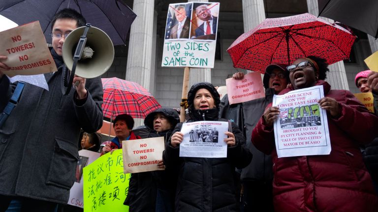 After filing a lawsuit to stop the development of four high-rise&nbsp;buildings in the Two Bridges neighborhood of Manhattan on Friday, Lower East Side and Chinatown residents rallied outside the courthouse at 60 Centre St.