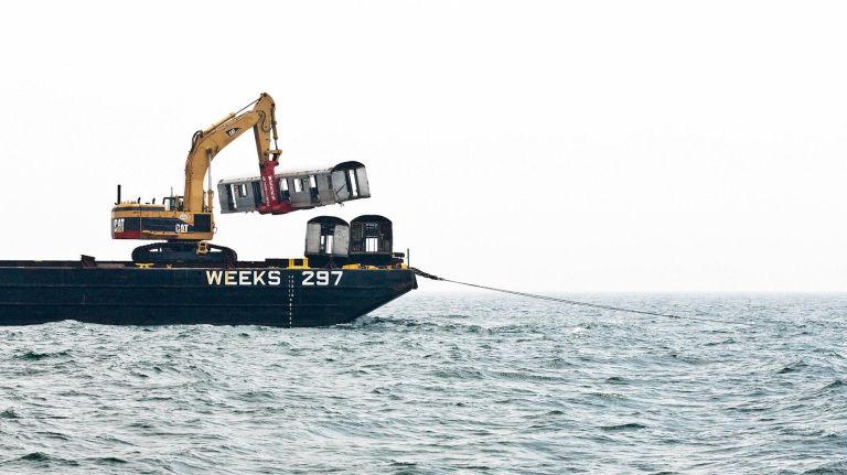 In "The End, 2008," A subway car is about to be placed into the ocean.