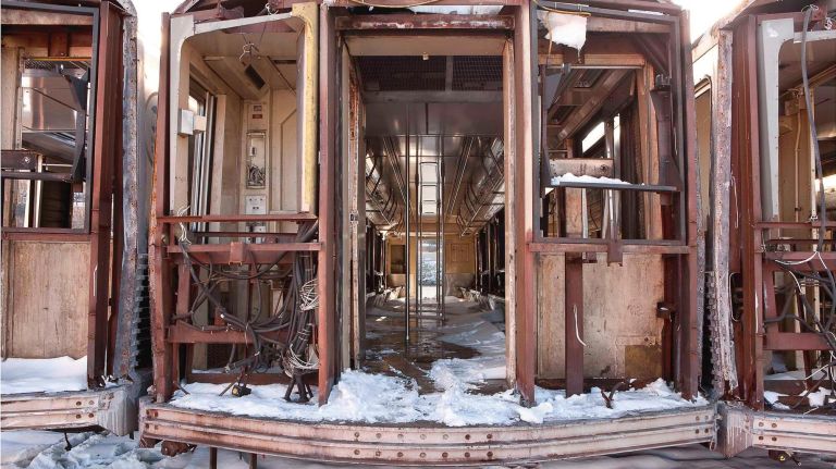 In "Transfer, 2009," the stripped down subway cars are seen before they're submerged.