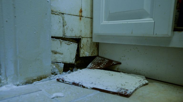 Tenants of a rent-stabilized building in the Bronx say their landlord isn't making needed repairs, like this hole in one unit's bathroom.